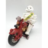 A collector?s item, French, cast iron, MITCHELIN MAN, on a motorbike. Wheels turning with special