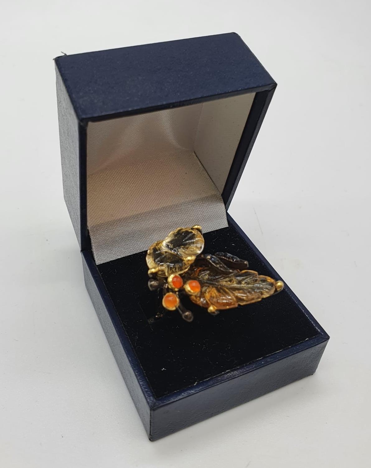 A unique Edwardian silver (unmarked) ring with carved semiprecious and precious stones (citrine,