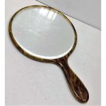 Faux tortoiseshell vintage oval hand mirror. 15cm diameter.