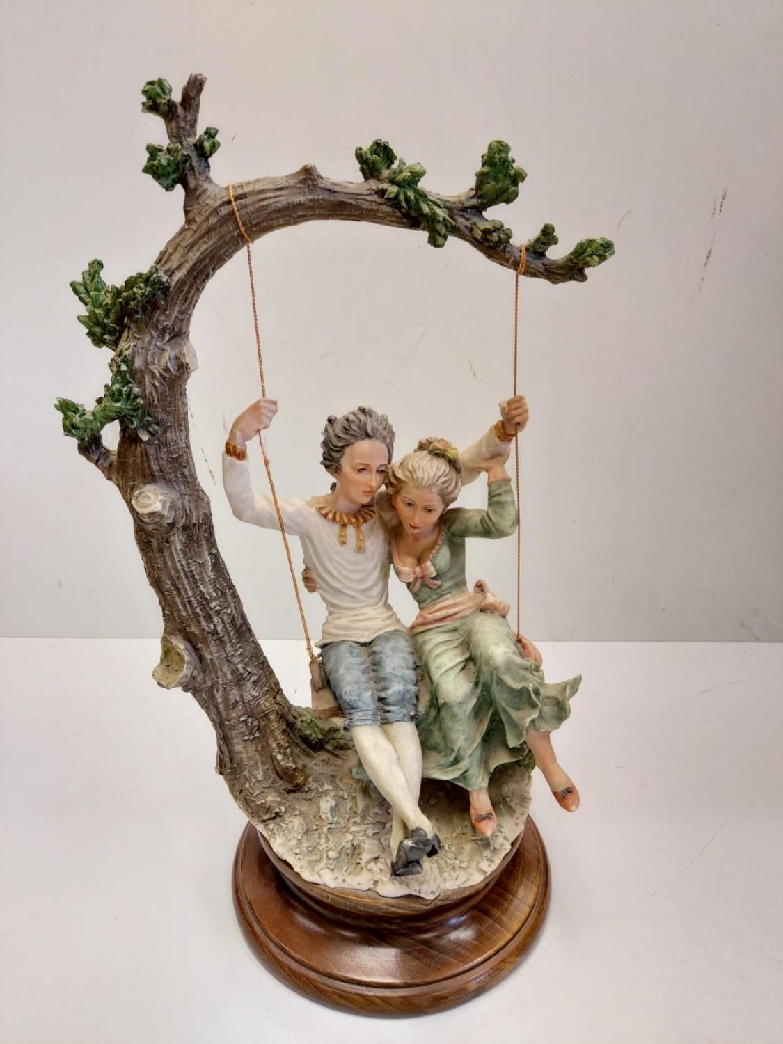 A Giuseppe Armani Capodimonte, 'Lovers on a Swing' figurine. 45cm in height.