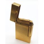 A vintage gold plated ST. Dupont lighter. Needs new flint and gas.