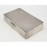 Silver cigarette box with wood interior. Hall marked London 1915. 338 grams. 15x9cms.