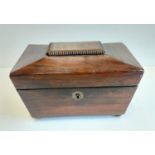 An antique mahogany tea caddy with two lidded compartments. 20x11cm.