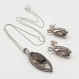 Silver necklace and earrings set with smokey quarts stones.