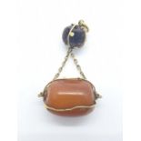 An actual amber pendant of 9ct gold. Weight 5.1g.