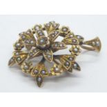 Vintage 9ct gold Victorian broach. In floral design with seed pearls. Weight 5.1g.