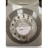 Grey retro-phone with coil cord handset and turn dial. 11.5 x 14cm (24.5cm handset).