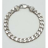 Silver bracelet having heavy flat links with lobster clasp fastening. 8.5 inches / 21.5 cm approx.