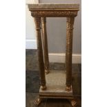 A pedestal empire style table with twin marble slabs. Gilt decorated legs and feet. 65cm in height.