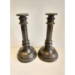 A pair of Victorian brass candlesticks.