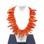 A massive red coral necklace with a large silver (stamped 925) clasp in a presentation box. Coral