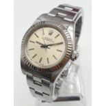 Ladies Rolex Oyster Perpetual with champagne colour face and steel bracelet, 26mm case, come with
