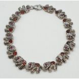 Silver gem set, elephant bracelet. Stones test as tourmaline. 19.5cm approx.