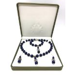 A Tibetan silver and lapis lazuli necklace, bracelet and earrings set in a presentation box.