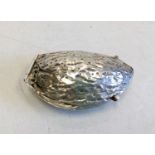 A hallmarked silver pill box, shaped like an almond. 5cm long and 16g.