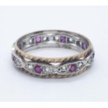 9ct ruby and white sapphire eternity ring. 2.6g in weight. Size O.