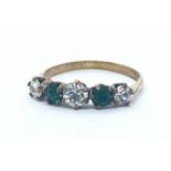 9ct ring with green and white stones. 1g in weight, size M.