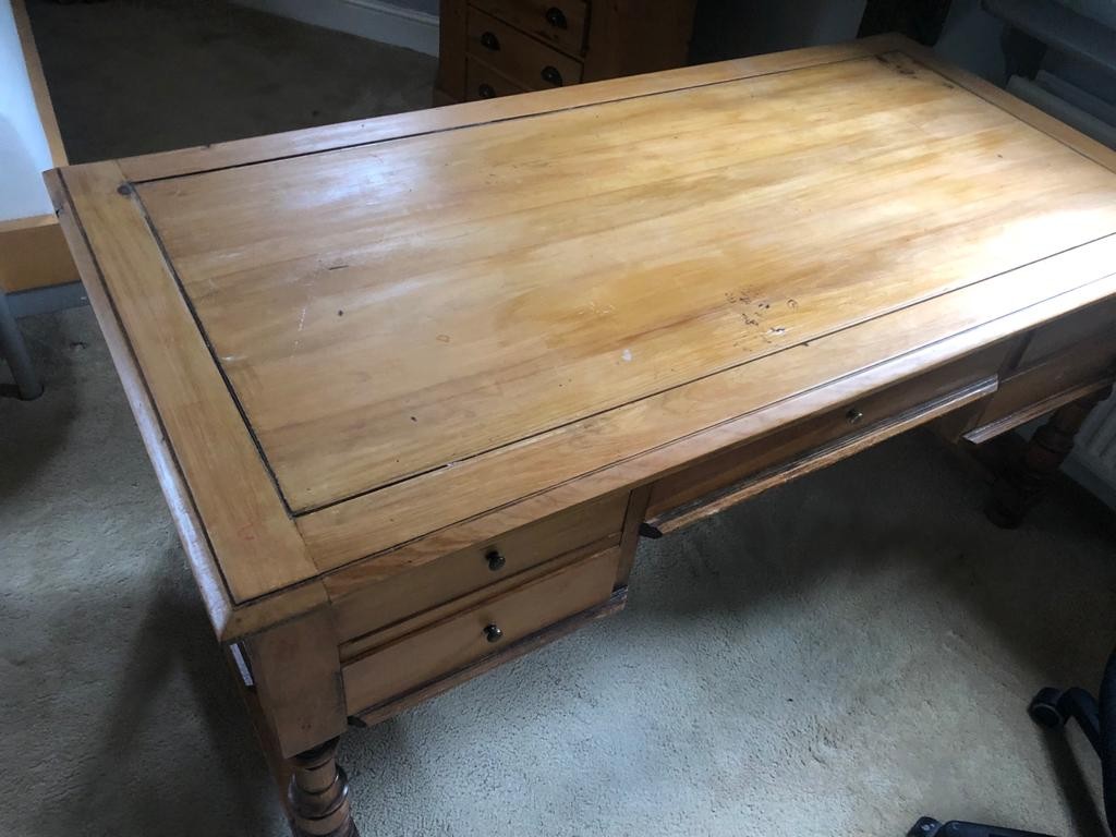 A wooden partners desk - some surface damage. 160 x 80 x 74cm.