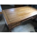 A wooden partners desk - some surface damage. 160 x 80 x 74cm.