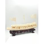 Antique Chinese ivory barge with many carved figures on original wooden base, 26 x 17 x 4cm approx