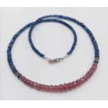 A 83cts kyanite and ruby gemstone necklace in sterling silver. 16.7 grams in weight. 44cm approx