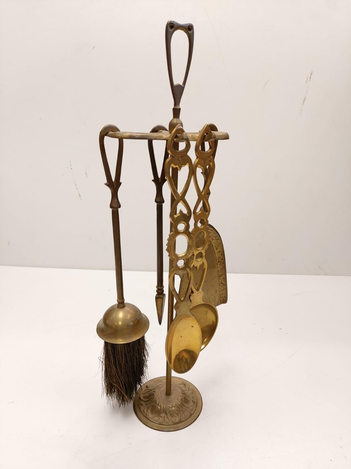 A bronze selection of vintage fireside utensils including decorated brass bellows. - Image 6 of 9