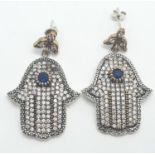 A pair of silver hand shaped earrings, with central sapphires. 14.8g in weight.