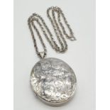 Vintage Large Silver Locket having scroll work to front. Mounted on a long silver belcher type