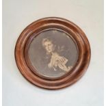 An antique circular print of a 'Women with a Secret' in a walnut frame. Diameter 34cm.