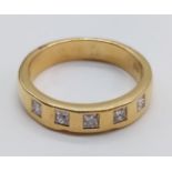 18CT YELLOW GOLD WITH 5 EMERALD CUT DIAMOND SET BAND RING, WEIGHT 4.9G AND SIZE K,