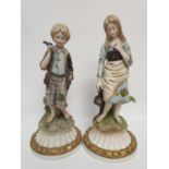 A pair of Capodimonte youths. 22cm in height.