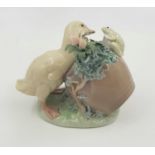 A Lladro porcelain figurine of a duck and frog at play. Good condition. 12 x 10 cm.