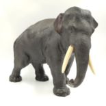 A beautiful bronze elephant sculpture (circa 1930) with ivory tusks, Japanese marked possibly Seya