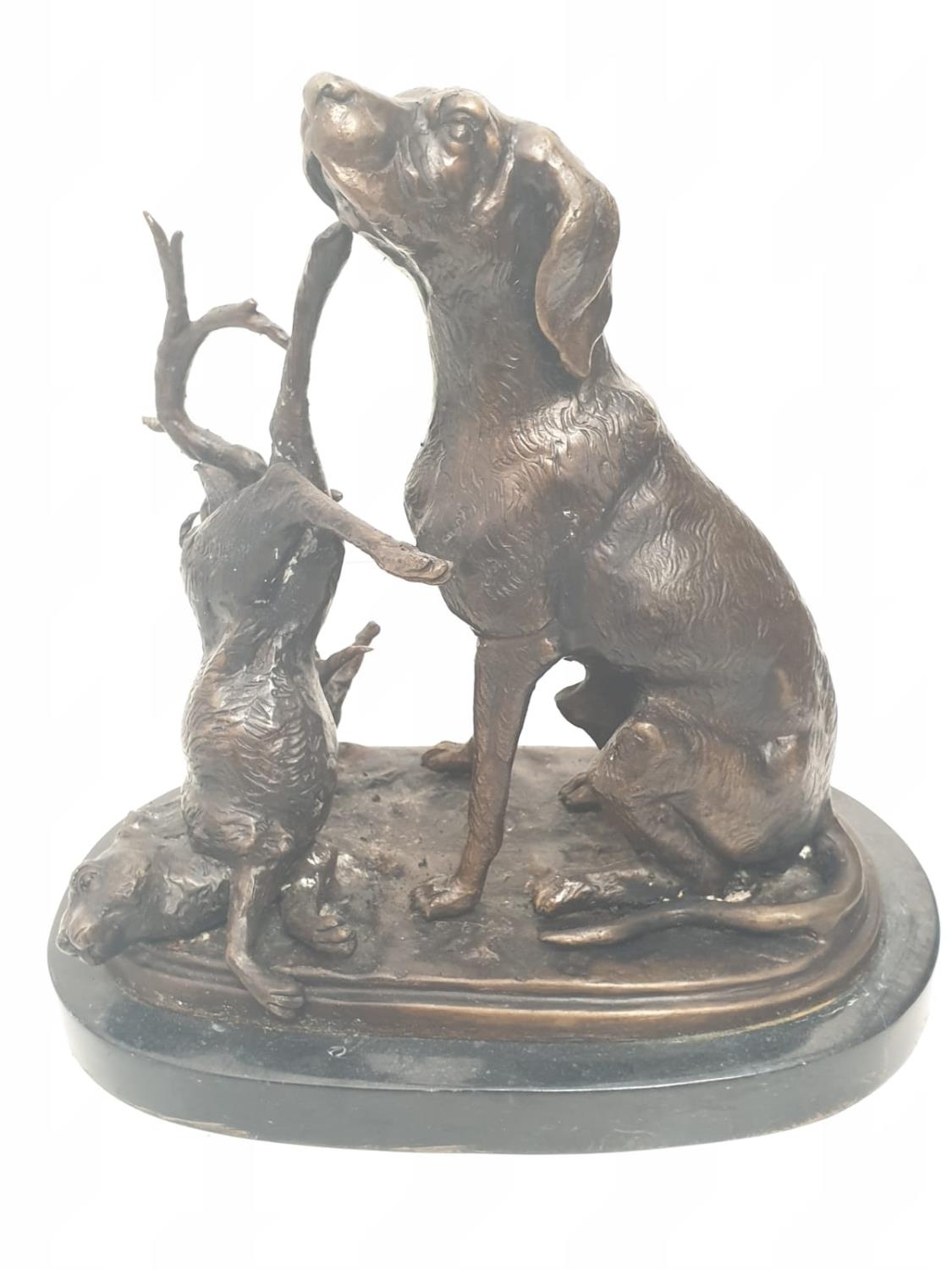 A vintage bronze sculpture of a hunting dog and an unlucky rabbit. 25 x 25 cm.