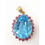 Topaz and ruby in 14ct gold pendant, weight 8g