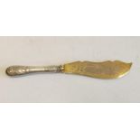 A silver gilt-in scripted large fish knife; with decorated handle. 27cm long.