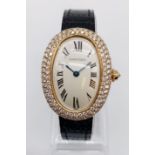 Vintage 18ct gold Cartier ladies quartz watch with oval face and diamond encrusted bezel, Cartier