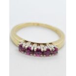 14ct yellow gold with 5 rubies. Size N. 3.3g in weight.