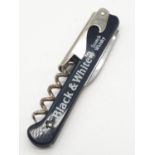 Vintage advertising pen knife for Black & White Scotch Whiskey. Having corkscrew and bottle opener