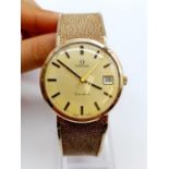 OMEGA Geneve 9ct gold vintage gent watch, manual wind with date box and solid gold strap, 32mm