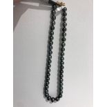 Tahitian pearl necklace graduated; 14k gold clasp and aprox 17"