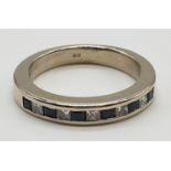 18ct White gold half eternity ring with inset sapphire. 4.9g and size K.