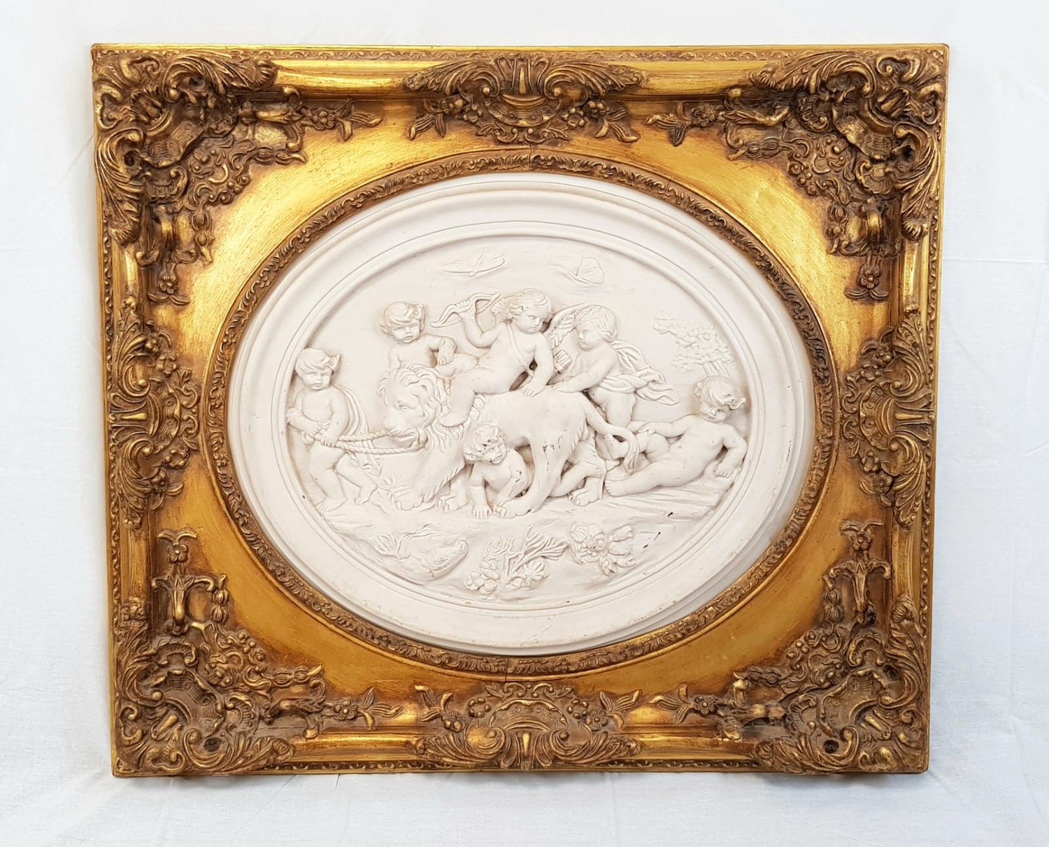 A Louis-Alexandre Bottee styled alabaster relief piece of cherubic children. Comes in original,