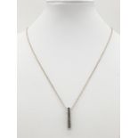 A high quality, Art Deco,18 carat white gold pendant with black and white diamonds. 38 white and