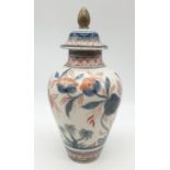 Early Chinese ginger jar with lid, hand painted floral design with some cracked damage at mouth of