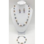 A good collection of Kasumi pearls with vivid colours forming a necklace, bracelet and earrings set,