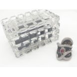 A hand cut, lead crystal, trinket box, revealing an unusual ring of large proportions with black