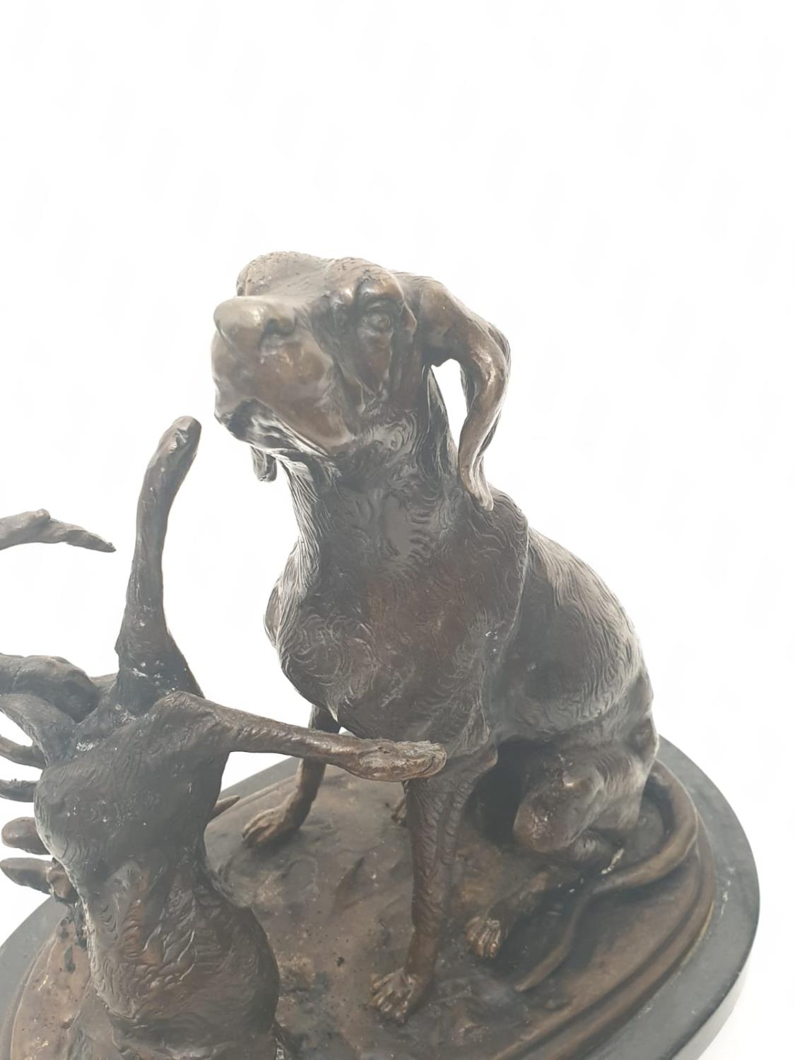 A vintage bronze sculpture of a hunting dog and an unlucky rabbit. 25 x 25 cm. - Image 2 of 6