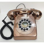 A vintage style analogue phone in metallic style - in working order.