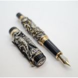 Jinhao dragon pen in black. Having a dragon and birds in relief work to outer case. 18ct gold plated